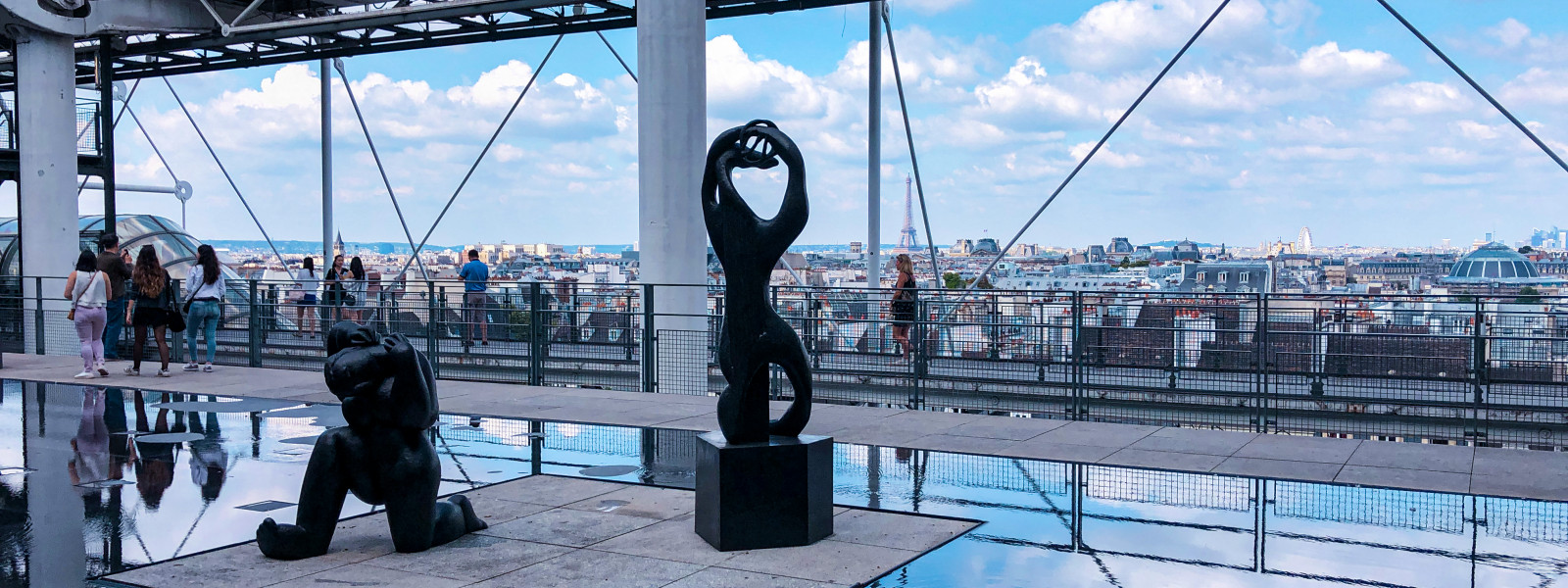 Looking out from a sculpture garden within the Centre Pompidou, one can see the Eiffel Tower.