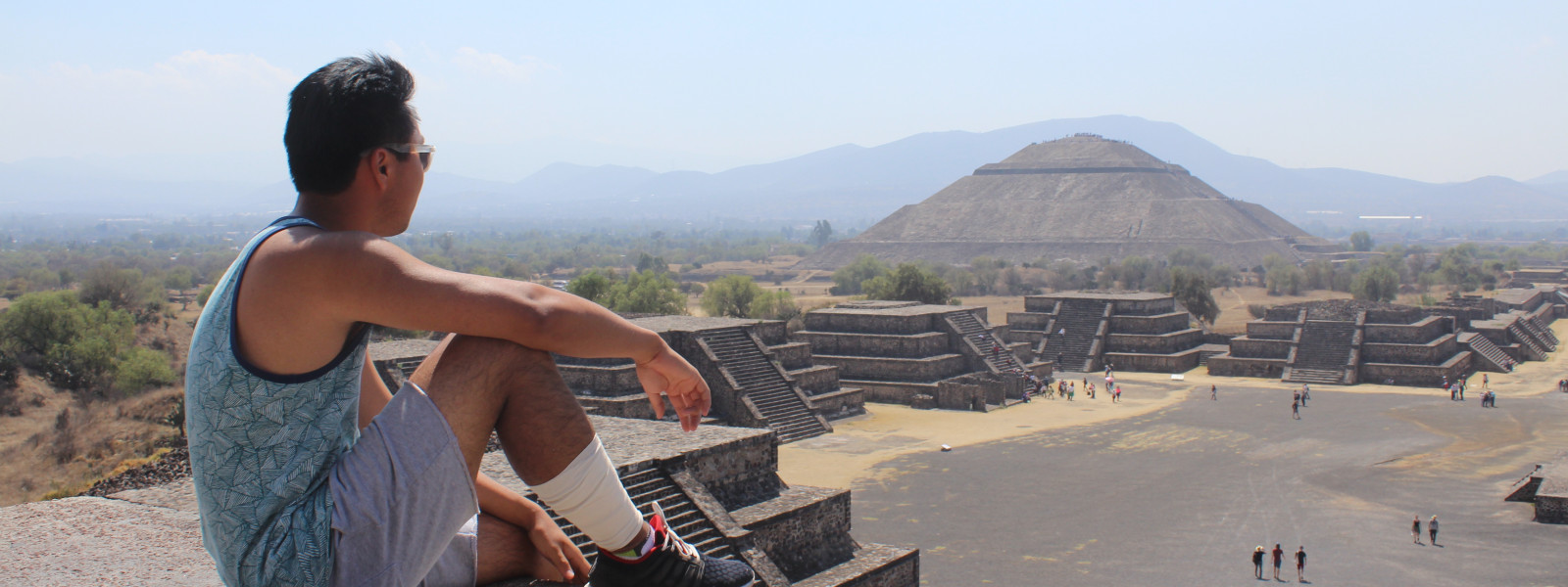 Student sitting and enjoying view of the Pyramid of the Moon