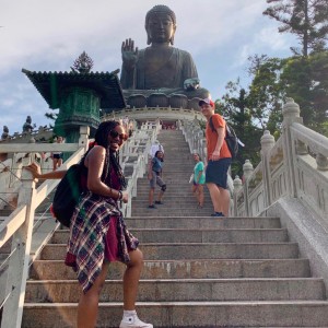 Students pause for a photo as they make their way up the stairs to see the Buddha statue.