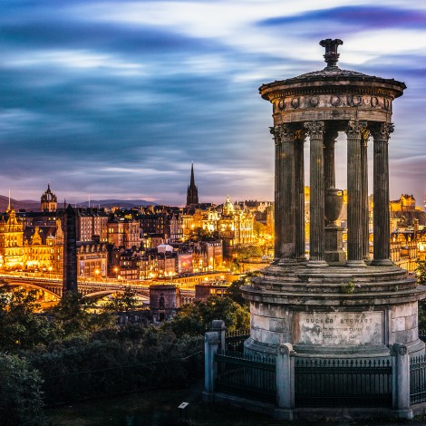 Night view of the Dugald Stewart Monument on Calton Hill overlooking the city of Edinburgh