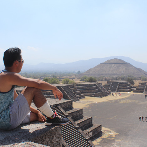 Student sitting and enjoying view of the Pyramid of the Moon